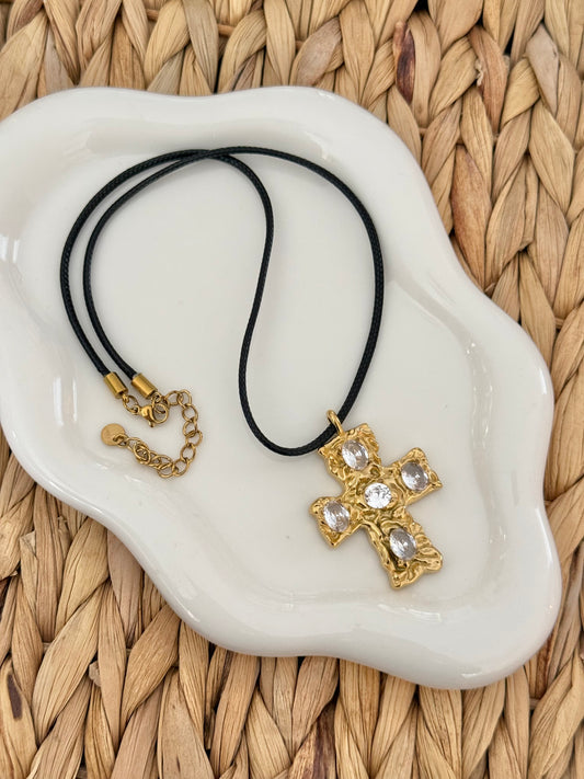 Large gold cross on leather