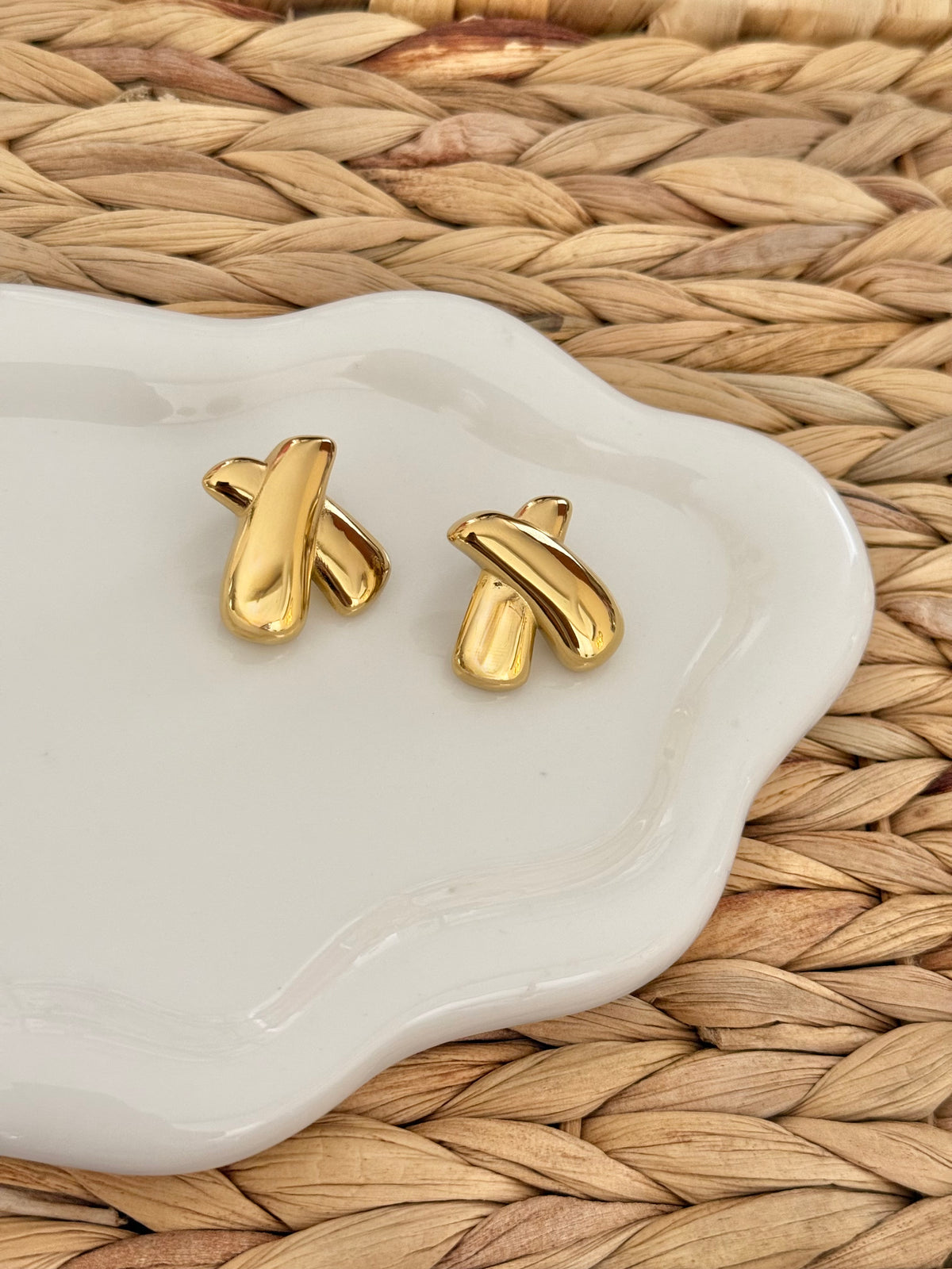 X gold earrings